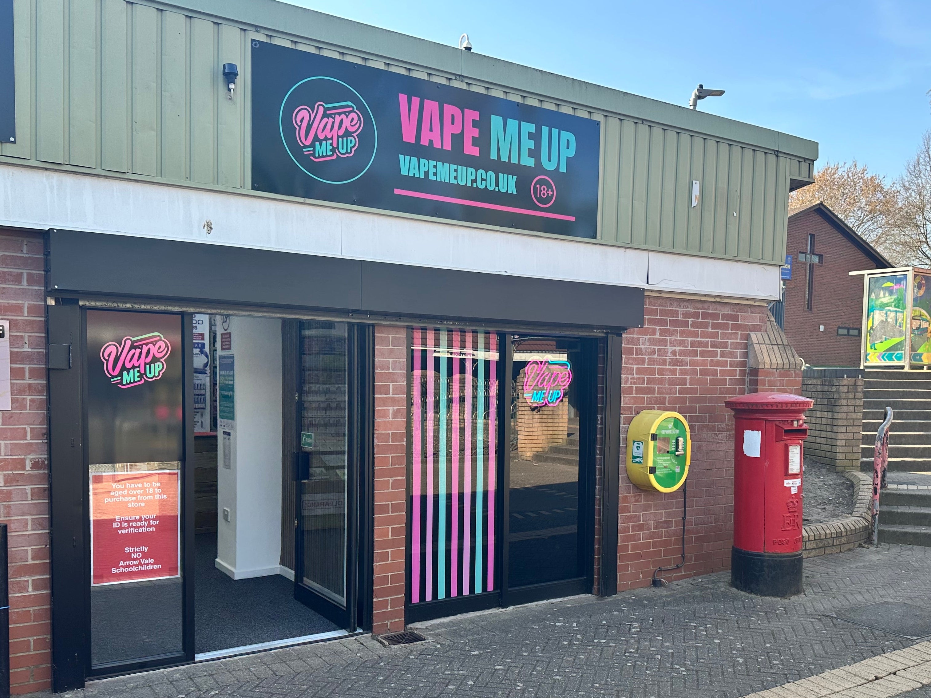 Vape shop in Matchborough Centre named 'Vape Me Up' with a red post box in the background.